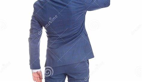 Задний вид Suitindex Бизнесмен в костюме указывает вверх указательный палец