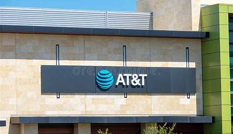 Корпоративный логотип Att Store Locationfaq и вывеска на фасаде Location San